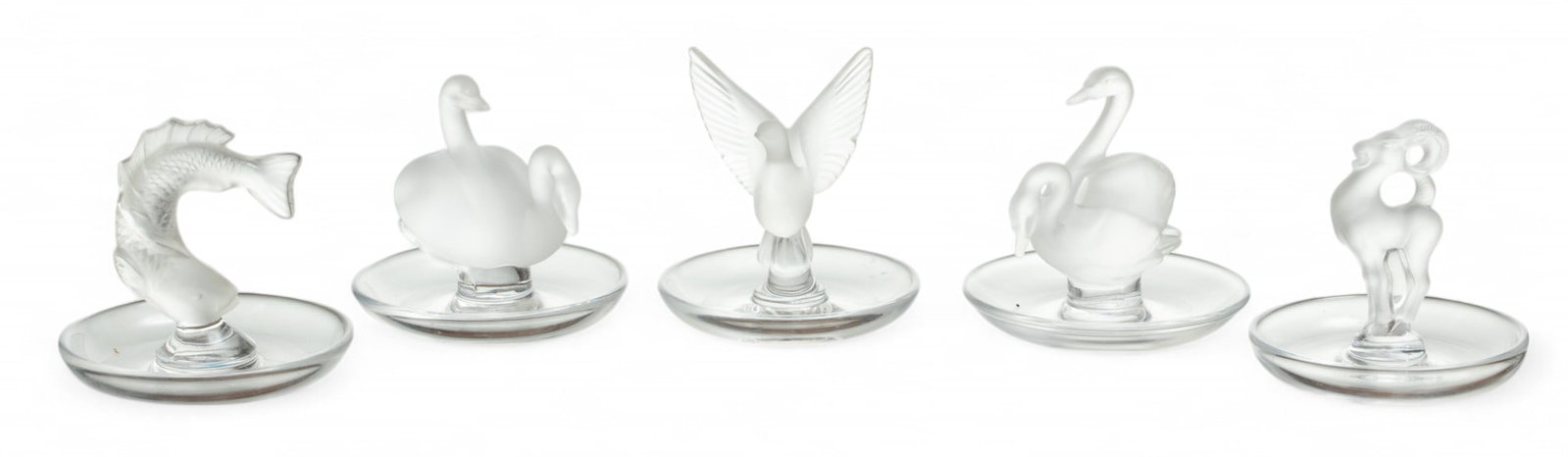 Lalique (French) Frosted Crystal Pin Trays: Lalique (French) Frosted Crystal Pin Trays The collection of pin trays include 'Goujon', 'Deux Cygnes', 'Thalie' and 'Bastia'. Each bearing signature branding incised to the undersides. Dimensions: 'G