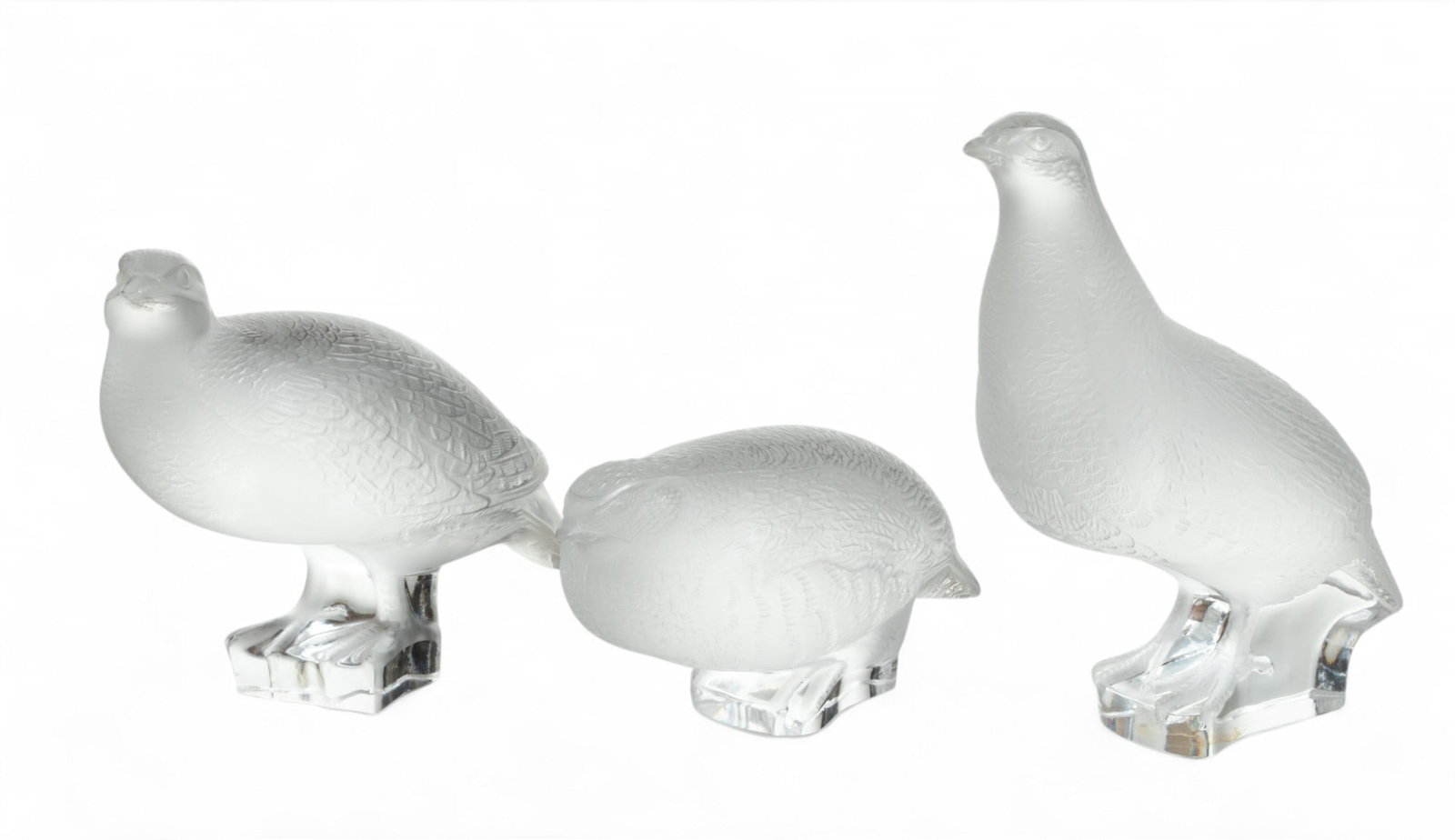 Lalique (France) Frosted Crystal Partridges H 7" W 3" Depth 5.5" 3 PCS: Lalique (France) Frosted Crystal Partridges H 7" W 3" Depth 5.5" 3 PCS The lot includes the 'Head Up', 'Worry' and 'Squat' partridges, rendered in frosted crystal. Each bearing signature branding inci