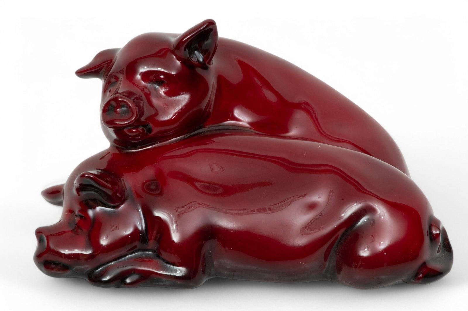 Royal Doulton (English) Flambe Glazed Bone China Figurine, Snoozing Pigs H 3.8" W 7" Depth 4": Royal Doulton (English) Flambe Glazed Bone China Figurine, Snoozing Pigs H 3.8" W 7" Depth 4" The flambe glazed bone china figurine in the form of two snoozing pigs. Bearing signature branding to the 