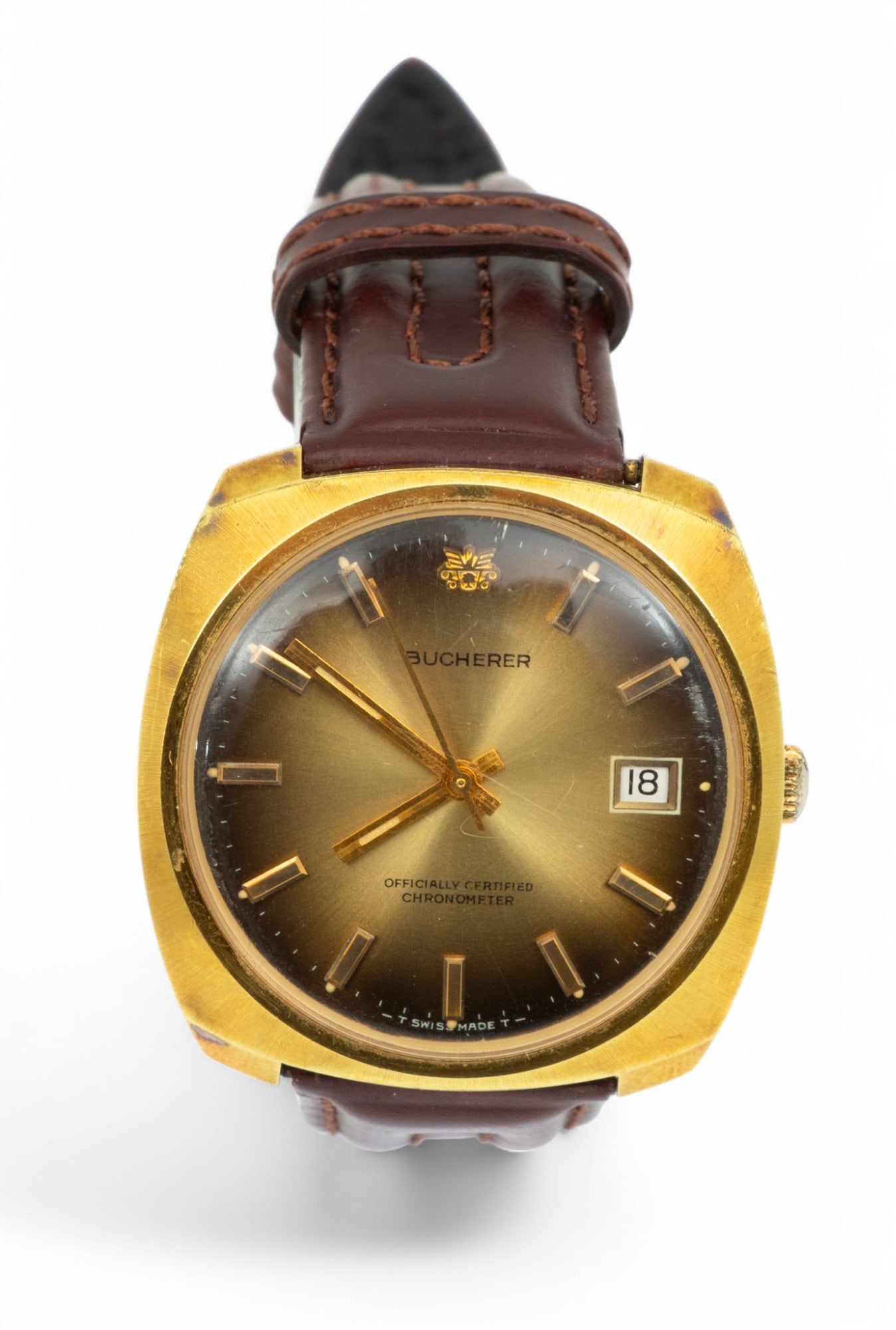 Bucherer (Swiss) Chronometer Wristwatch L 10" 49g: Bucherer (Swiss) Chronometer Wristwatch L 10" 49g The dial having notched hour markers and a date window at the 3:00 position. On a leather strap bracelet. Total weight: 49 grams. Provenance: Propert