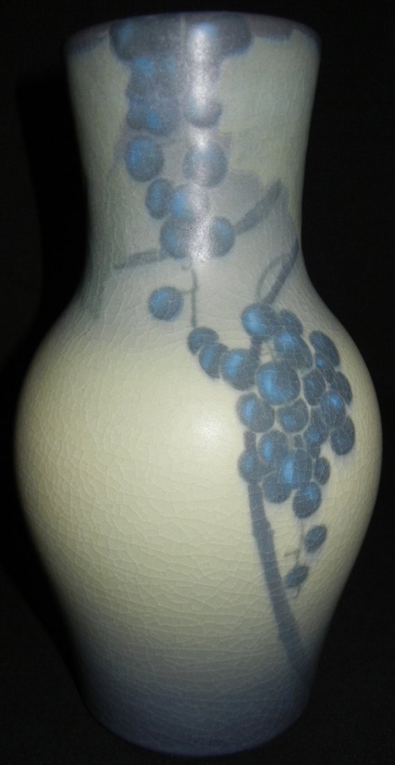 SALLY COYNE, ROOKWOOD POTTERY VASE, H 9": SALLY COYNE, ROOKWOOD POTTERY VASE, H 9":Grape and vine design. In colors of greens, creams to grey blue. Numbered 1653., VIII. Actual size 9 1/2" H.