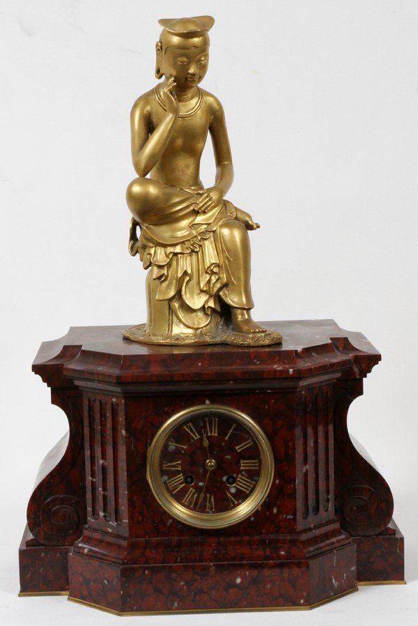 FRENCH MARBLE MANTLE CLOCK, H 9", L 14", D 7": FRENCH MARBLE MANTLE CLOCK, H 9", L 14", D 7":having a red marble case with a gilt metal Chinese seated man on top; brass framed glass bezel opening to a red marble face with gilt Roman numerals, two