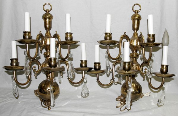 BRASS AND CRYSTAL FIVE-LIGHT SCONCES, PAIR: BRASS AND CRYSTAL FIVE-LIGHT SCONCES, PAIR:having scroll form arms with faux candle electric lights with tear drop shape prisms suspended from each arm; Height 22", Width approx. 17 1/2" , Depth 10".