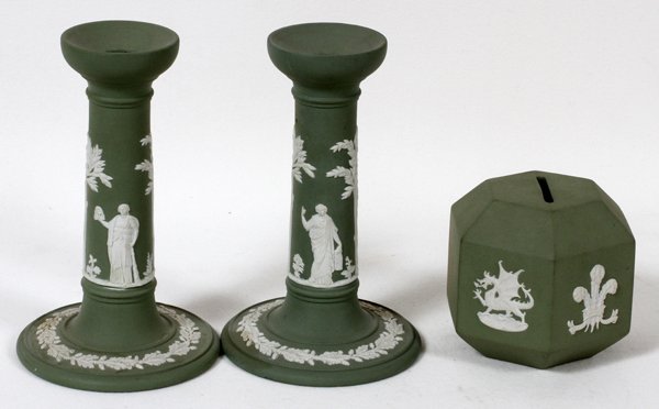 WEDGWOOD GREEN JASPERWARE CANDLESTICKS & BANK,: WEDGWOOD GREEN JASPERWARE CANDLESTICKS AND COIN BANK, 3 PCS., H 3 1/2" - 6 1/2":having two candle sticks with classical figures on the sides, ivy trim on the round bases, 6 1/2" H.; one hexagonal slot