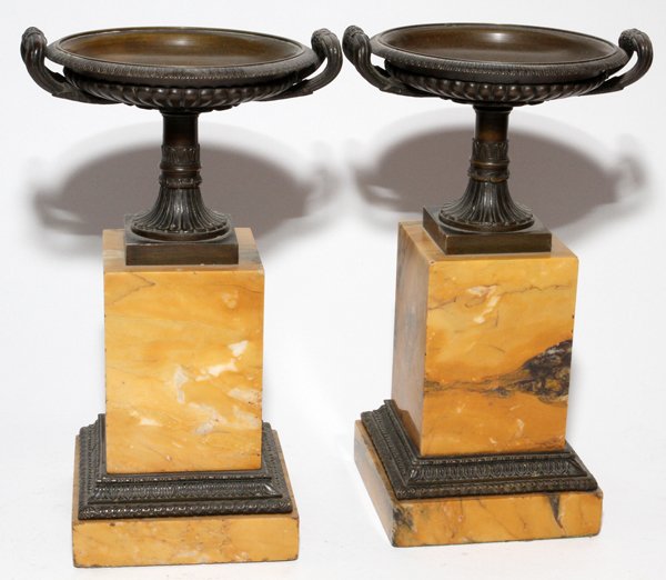 FRENCH BRONZE & MARBLE TAZZE, 19TH C., PAIR,: FRENCH BRONZE & MARBLE TAZZE, 19TH C., PAIR, H 10 1/2", W 6":Traditional form with caramel and black mottled marble plinths.