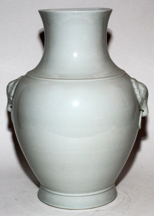 CHINESE BLANC DE CHINE PORCELAIN VASE, H 20",: CHINESE BLANC DE CHINE PORCELAIN VASE, H 20", DIA 13":Molded mask handles at either side and an unglazed foot. No apparent markings.