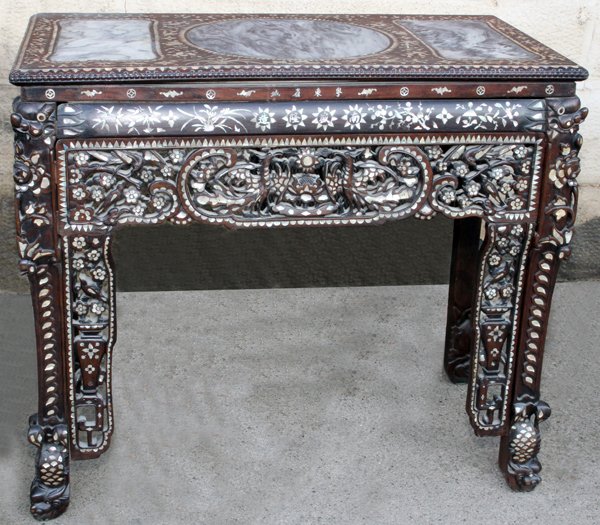 CHINESE CARVED & INLAID TEAKWOOD ALTAR TABLE,: CHINESE CARVED & INLAID TEAKWOOD ALTAR TABLE, 19TH C., H 42", W 47", D 23":Inset with three marble slabs at the top. Complete frame inlaid with mother of pearl. Signed along the frieze.