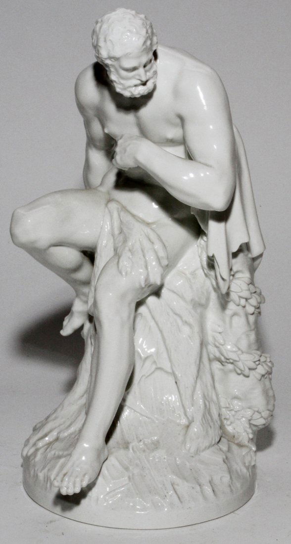 KPM/ROYAL PORCELAIN MANUFACTORY FIGURE OF A MAN: KPM/ROYAL PORCELAIN MANUFACTORY PORCELAIN FIGURE OF A MAN, 19TH C., H 12 1/4", W 6 1/2":Man in cloak seated on a stump. Blue under glaze scepter mark (see photo).