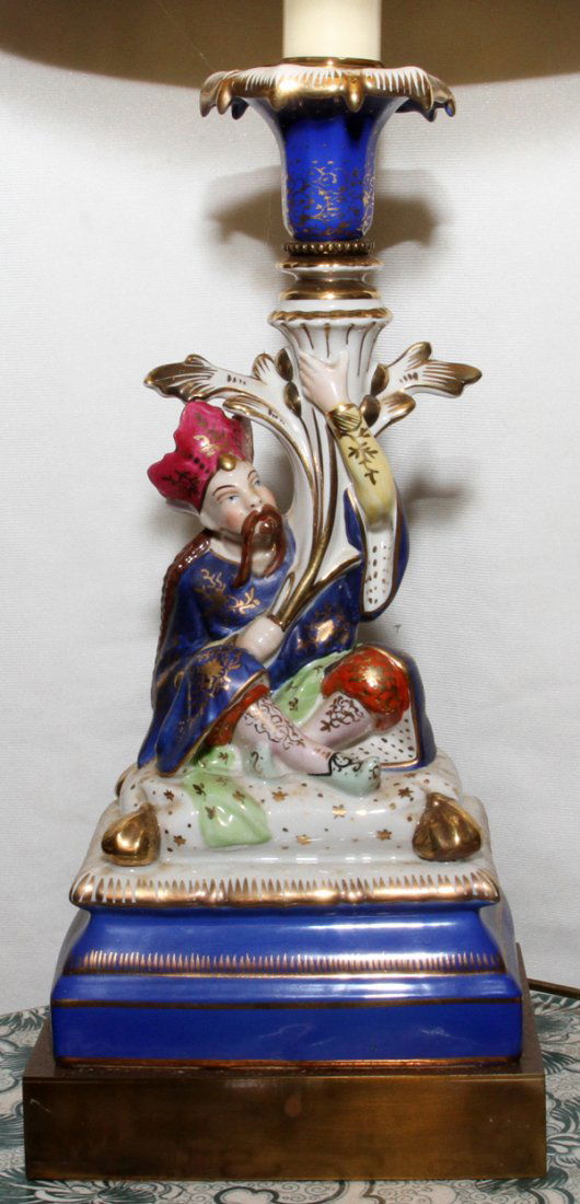JACOB PETIT PORCELAIN TURKISH CANDLESTICK,: JACOB PETIT PORCELAIN TURKISH FIGURAL CANDLESTICK, 19TH C., MOUNTED AS A LAMP:Figure of an Asian man holding a cornucopia, on a cobalt blue base.