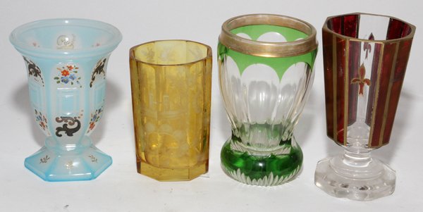 CONTINENTAL GLASS BEAKERS, 19TH C., FOUR, H 4"-5 1/2": CONTINENTAL GLASS BEAKERS, 19TH C., FOUR, H 4"-5 1/2":Including 1 paneled beaker with flashed ruby and fleur de lis, 1 etched amber to clear beaker, 1 green overlay to clear beaker and 1 paneled blue 