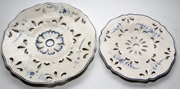 CONTINENTAL CREAMWARE PIERCED PLATES, TWO,: CONTINENTAL CREAMWARE PIERCED PLATES, LATE 18TH C., TWO, DIA 9 1/2" & 11 1/2":Each is similarly shaped and pierced, hand-painted in blue with floral sprays; the larger is marked in blue under glaze (s