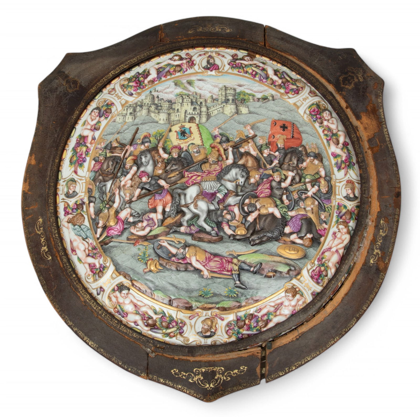 Italian Capodimonte Painted Porcelain Pictorial Shield, 19th C. Dia. 21": Italian Capodimonte Painted Porcelain Pictorial Shield, 19th C. Dia. 21" Depicting a hand-painted and gilded battle scene, surrounded by a frame of putto, fruit, and vignettes of generals encase