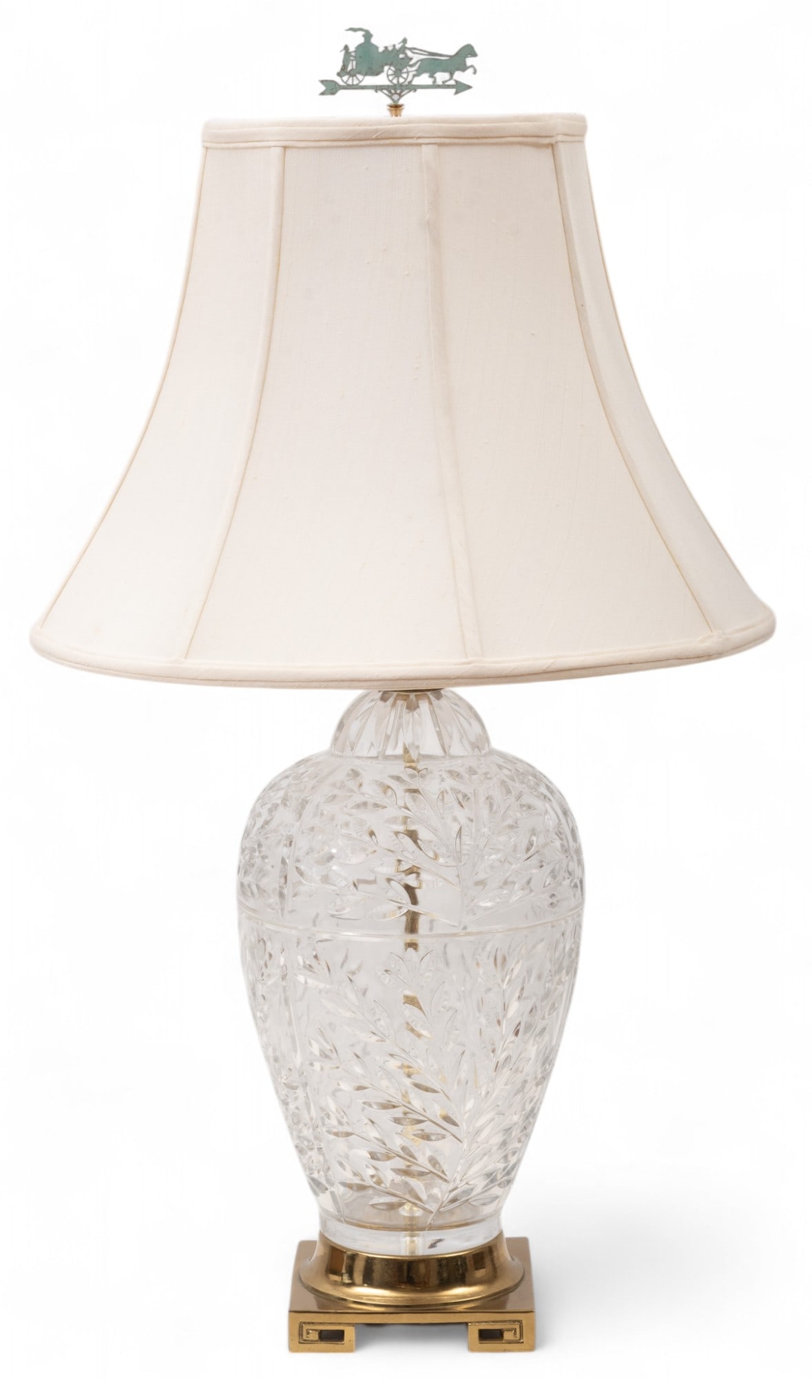Molded Glass And Brass Table Lamp H 32" Dia. 8.5": Molded Glass And Brass Table Lamp H 32" Dia. 8.5" Molded glass in an urn form with with foliate spray designs. Set on a brass base. Electrified with a single socket. Includes a cloth shade, Dia. 18".