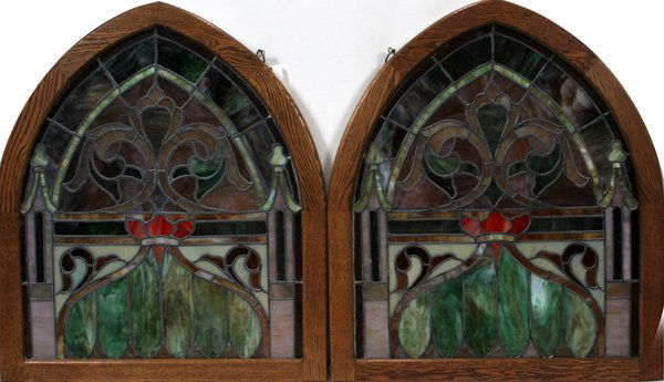 GOTHIC STYLE OAK AND STAIN GLASS WINDOWS: GOTHIC STYLE OAK AND STAIN GLASS WINDOWS, MID 20TH C, PAIR, H 37", W 32":having a gothic shape oak frame with a window scene of floral designs and lamp shade shape at the bottom.