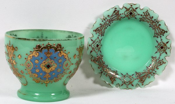 BOHEMIAN ENAMELED GLASS PUNCH BOWL WITH STAND: BOHEMIAN ENAMELED GLASS PUNCH BOWL WITH STAND, C. 1900, H 7", DIA 10":Harrach style punch bowl and stand, each piece is enameled in gold with lavender and blue accents and ruby colored cabochons on a 