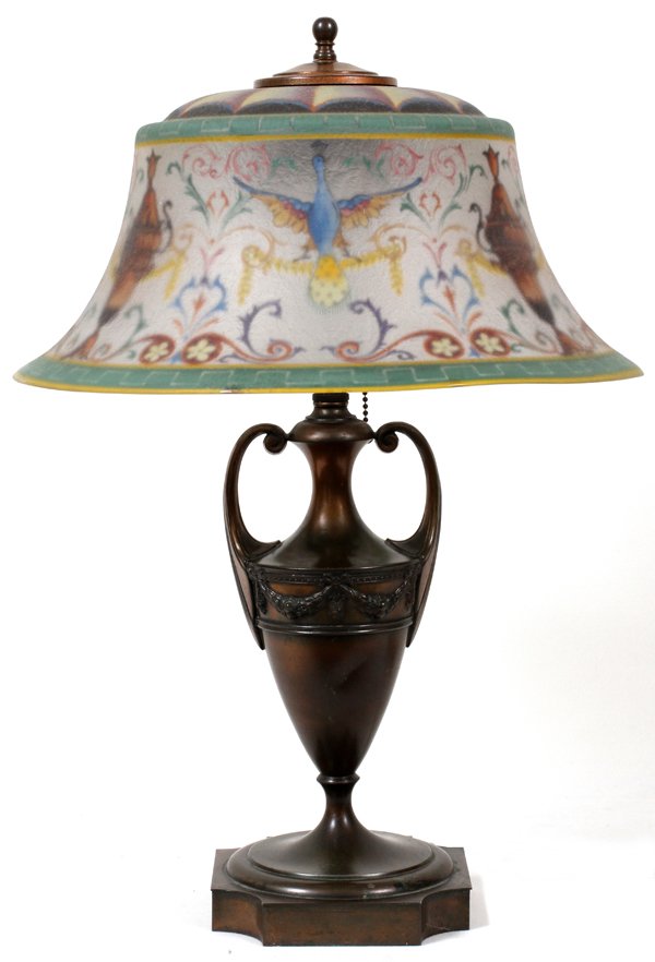 PAIRPOINT REVERSE PAINTED 'PEACOCK' TABLE LAMP: PAIRPOINT REVERSE PAINTED 'PEACOCK' GLASS TABLE LAMP, H 22", DIA 15":Round glass shade with flared rim, signed "Pairpoint" (see additional photo), raised on a patinated metal base also signed (see pho