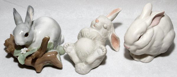 PORCELAIN FIGURES OF RABBITS, THREE, H 3", L 5": PORCELAIN FIGURES OF RABBITS, THREE, H 3", L 5":Including 1 Lladro rabbit, H.3 1/4"; 1 Boehm rabbit, "Newborn Sleeping", number 40217, L.5"; and 1 Cybis rabbit, H.3 1/2".