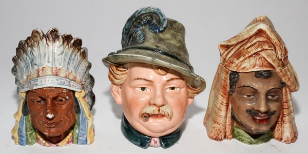 AUSTRIAN PORCELAIN TOBACCO JARS, C. 1890, THREE: AUSTRIAN PORCELAIN TOBACCO JARS, C. 1890, THREE, H 6":Including 1 figure of a German man in phumed hat, 1 of an American Indian Chief, and 1 of a Middle Eastern Arab.