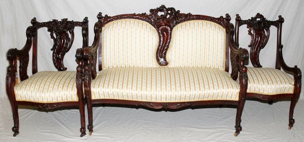 ENGLISH MAHOGANY SALON SUITE, THREE PCS: ENGLISH MAHOGANY SALON SUITE, THREE PIECES, 19TH CENTURY:Including a settee, L 37" x 53", all with deeply carved foliate crest with an open back, double cushioned back, scrolled arms with trellis styl