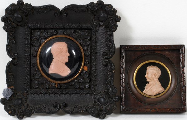 VIENNESE WAX MINIATURE PORTRAITS, 2, 19TH C: VIENNESE WAX MINIATURE PORTRAITS, 2, 19TH C., 2 1/4" X 1 5/8" & 2" X 1 1/2":Both framed with the larger one in a black Biedermeier frame.