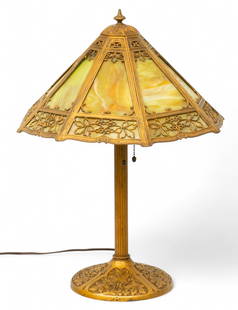 American Slag Glass Table Lamp 1915-1930, H 21" Dia. 16.5": American Slag Glass Table Lamp 1915-1930, H 21" Dia. 16.5" Original caramel glass panels inset in a patinated white metal frame. Mounted on a conforming base with finial. Provenance:  Collection of Ge