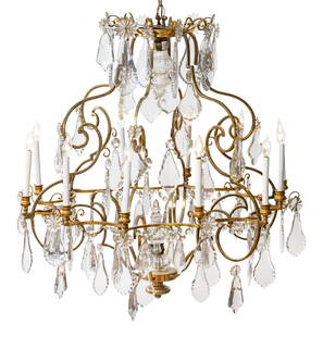 French Brass And Crystal Twelve Light Chandelier, Ca. 1820-1840, H 42" Dia. 42": French Brass And Crystal Twelve Light Chandelier, Ca. 1820-1840, H 42" Dia. 42" Early 20th century French brass chandelier, converted from candlelight. Twelve candlestick lights on a scrolling brass f