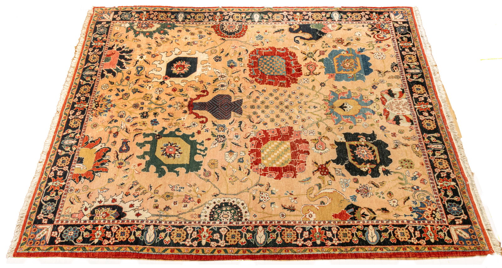 Black Mountain Looms (India) Mahindra Handwoven Wool Rug W 8' 5" L 11' 2": Black Mountain Looms (India) Mahindra Handwoven Wool Rug W 8' 5" L 11' 2" Light salmon-colored field with a central urn and flower design with overall scrolling floral patterns. Outer black border wit