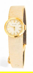 Rolex (Swiss) 18kt Yellow Gold Lady's Wristwatch, Ca. 1960s, 'Orchid Model', L 8" 11 g: Rolex (Swiss) 18kt Yellow Gold Lady's Wristwatch, Ca. 1960s, 'Orchid Model', L 8" 11 g A dainty lady's Rolex Orchid model wristwatch in 18kt yellow gold, leather band. Appx. .625 diameter dial. Dimens