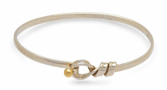 Tiffany & Co (Ny) Vintage Sterling Silver And 18k Yellow Gold Cuff Bracelet W 2.25": Tiffany & Co (Ny) Vintage Sterling Silver And 18k Yellow Gold Cuff Bracelet W 2.25" A classic sterling silver Tiffany &amp; Co. cuff bracelet in a looped lariat catch design with 18k yellow gold accen