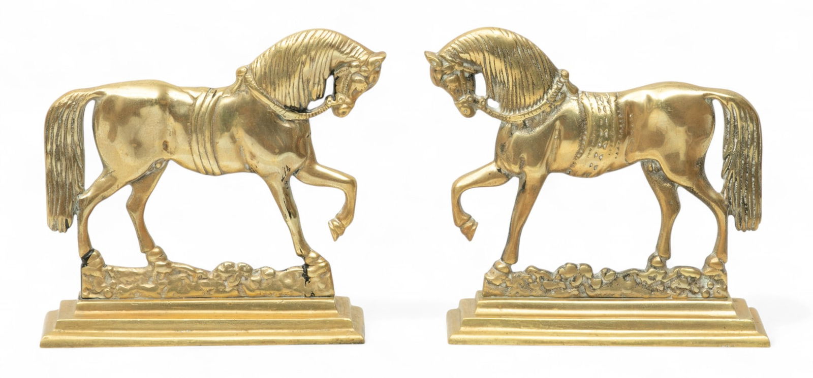 English Brass Horse Formed Doorstops, 20th Cen., H 9.25" W 10" 1 PAIR: English Brass Horse Formed Doorstops, 20th Cen., H 9.25" W 10" 1 PAIR Each in the form of a walking horse on stepped bases. Provenance: The Beardslee Family Estate, Grosse Ponte Farms, MI Dimen