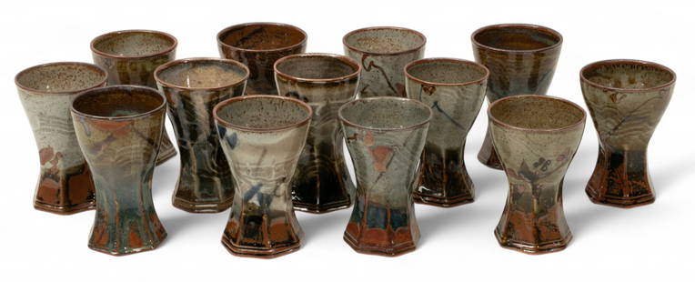 John Glick (American, B. 1938-2017) 13 Ceramic Goblet, Ca. 20th Cent, H 5.25" Dia. 3.75" 13 PCS: John Glick (American, B. 1938-2017) 13 Ceramic Goblet, Ca. 20th Cent, H 5.25" Dia. 3.75" 13 PCS Set of 13 ceramic goblets. H.5-5.5" hand made heights have slight variations. Marked Glick, Plum Tree Po