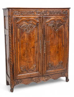 Country French Carved Walnut Diminutive Armoire, 19th Cent., H 62.5" W 52.5" Depth 17.5": Country French Carved Walnut Diminutive Armoire, 19th Cent., H 62.5" W 52.5" Depth 17.5" Having carved relief floral and lattice frieze above two caved walnut paneled doors.&nbsp; Provenance:  The Bea