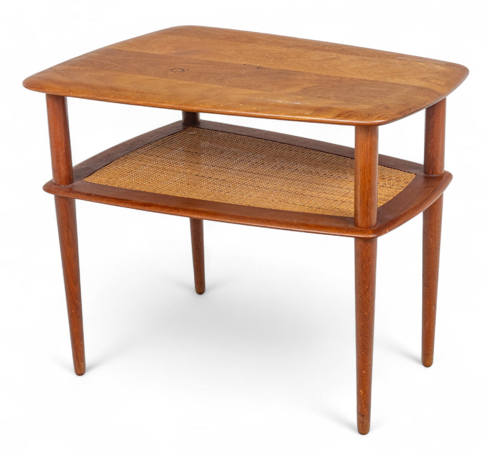 Peter Hvidt (Danish) for John Stuart Inc. Teak And Cane End Table H 23" W 20.75" L 28": Peter Hvidt (Danish) for John Stuart Inc. Teak And Cane End Table H 23" W 20.75" L 28" Solid teak table top with a woven cane shelf. Four tapered legs. Marked on the underside Made in Denmark, with a