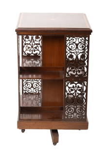 Mahogany with Satinwood Inlay Revolving Bookcase 1930, H 34" W 19" L 19": Mahogany with Satinwood Inlay Revolving Bookcase 1930, H 34" W 19" L 19" Two shelves, pierced side panels. On casters. Provenance: Property of a Bloomfield Hills, MI private collector.