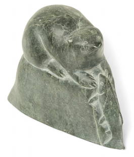 Paulosie Sivuak (Inuit, 1930-1986) Rock Carving 'Seal And Salmon', H 6" W 2.25" L 8": Paulosie Sivuak (Inuit, 1930-1986) Rock Carving 'Seal And Salmon', H 6" W 2.25" L 8" Signed on the underside with a location of&nbsp;Povungnituk (Quebec, Canada). Recumbent seal on a rocky outcrop wit