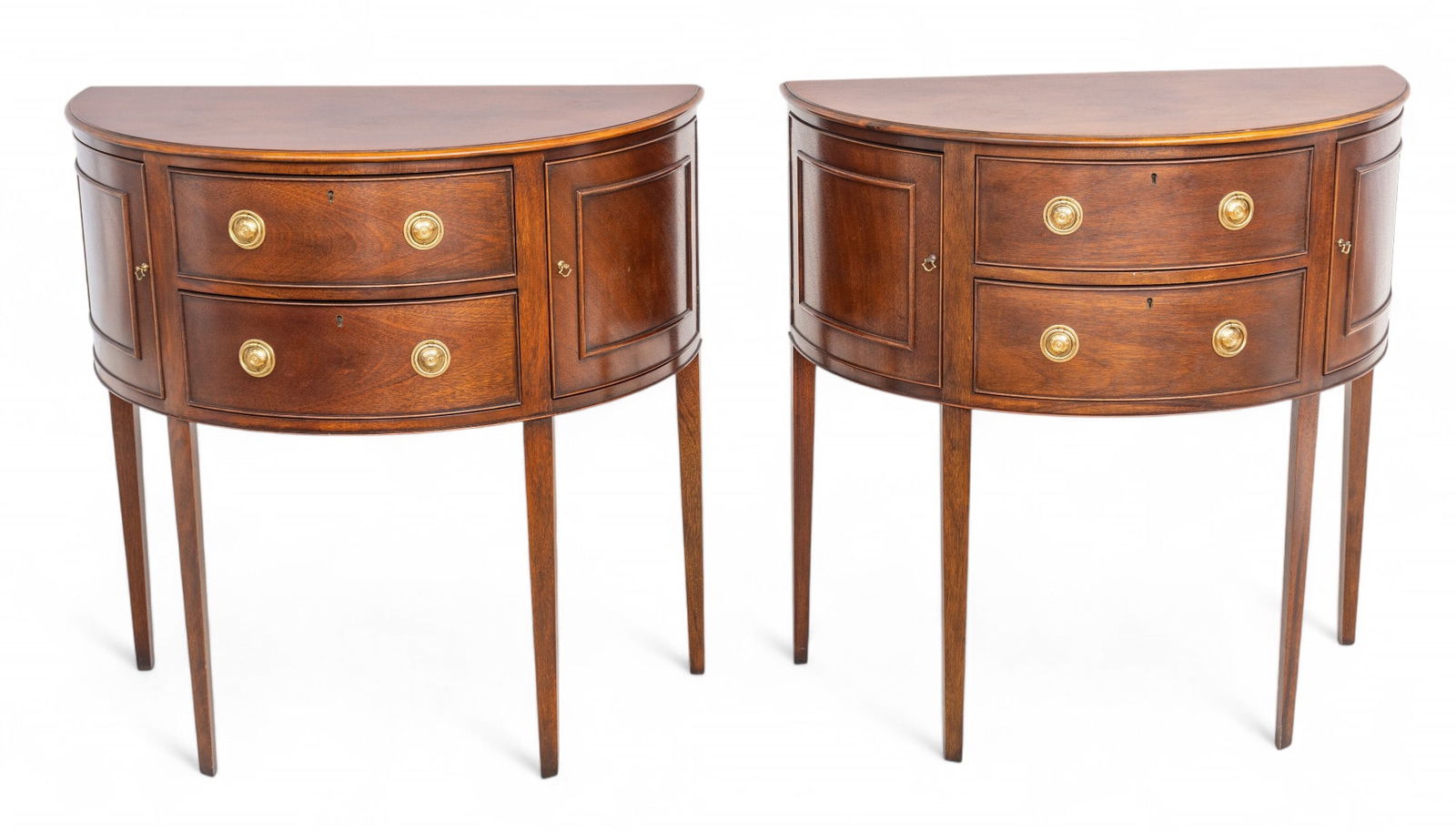 Baker Furniture Co Mahogany Demi-Lune Credenzas 20th C., H 34" W 34" Depth 18" 1 PAIR: Baker Furniture Co Mahogany Demi-Lune Credenzas 20th C., H 34" W 34" Depth 18" 1 PAIR Part of the Historic Charleston Collection. Provenance: Property from a prominent Provencal Rd., Grosse Poin