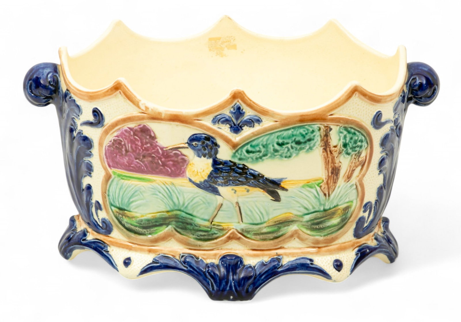 French Majolica Kingfisher Planter 1870-1890, H 8" W 14.5" Depth 9": French Majolica Kingfisher Planter 1870-1890, H 8" W 14.5" Depth 9" Double handles flank scalloped rim. Footed. Center cartouches have semi relief scene depicting kingfisher in a marsh. Unmarked. 