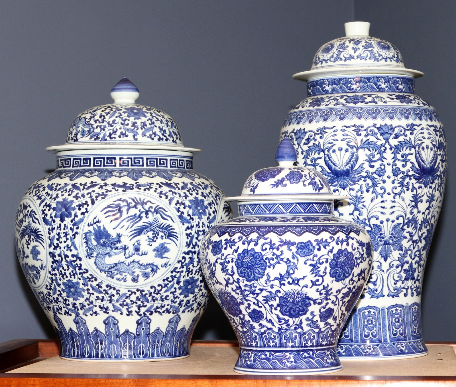 Chinese Porcelain Lidded Urns, H 12"-19" 3 PCS: Chinese Porcelain Lidded Urns, H 12"-19" 3 PCS All with blue on white decoration. Includes two with floral motifs, and one decorated with dragon scenes. Provenance: The Estate of Stephen J. Engle of