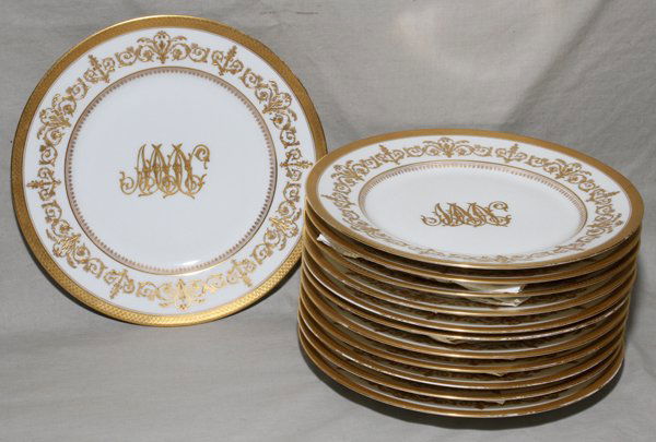 LIMOGES PORCELAIN DINNER PLATES, SET OF TWELVE: LIMOGES PORCELAIN DINNER PLATES, SET OF TWELVE, DIA 9.5":Wide fired gold border. Gold Florentine design band. Monogram. C. Ahrenfeldt, retailed by Wright Kay & Co. Monogram appears to be "MMN". Or may