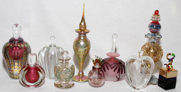 ARTIST SIGNED & STUDIO GLASS PERFUME BOTTLES: ARTIST SIGNED & STUDIO GLASS PERFUME BOTTLES, C. 1980-2000, TEN, H 3"-8", INCLUDING TOM PHILABAUM:Including 1 with a floriform finial, signed and dated "E. Roman '81";1 Niki de Saint Ralle cobalt perf