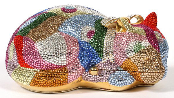 JUDITH LEIBER CRYSTAL SLEEPING CAT MINAUDIERE: JUDITH LEIBER MULTICOLOR CRYSTAL SLEEPING CAT MINAUDIERE, W 6":Colorful swaths overall, hinges open to comb, mirror, and coin purse, stamped "Judith Leiber".