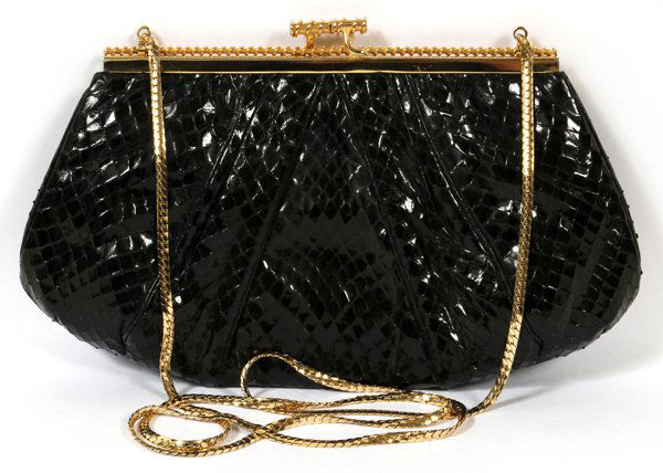 JUDITH LEIBER BLACK SNAKESKIN EVENING BAG: JUDITH LEIBER BLACK SNAKESKIN EVENING BAG, W 9 1/2":Clutch style bag with gold tone clasp opening to fabric lined interior with a zippered pocket. Stamped "Judith Leiber" within. Measures W.9 1/2" x 5