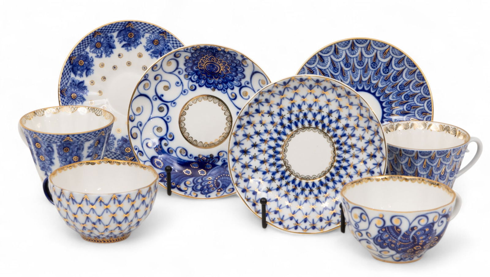 Russian Porcelain Tea Cups & Saucers, Four Sets H 3" 8 PCS: Russian Porcelain Tea Cups & Saucers, Four Sets H 3" 8 PCS Including 4 teacups and 4 matching saucers, each decorated with reticulated blue designs and fired gold accents. Marked at the underside of e