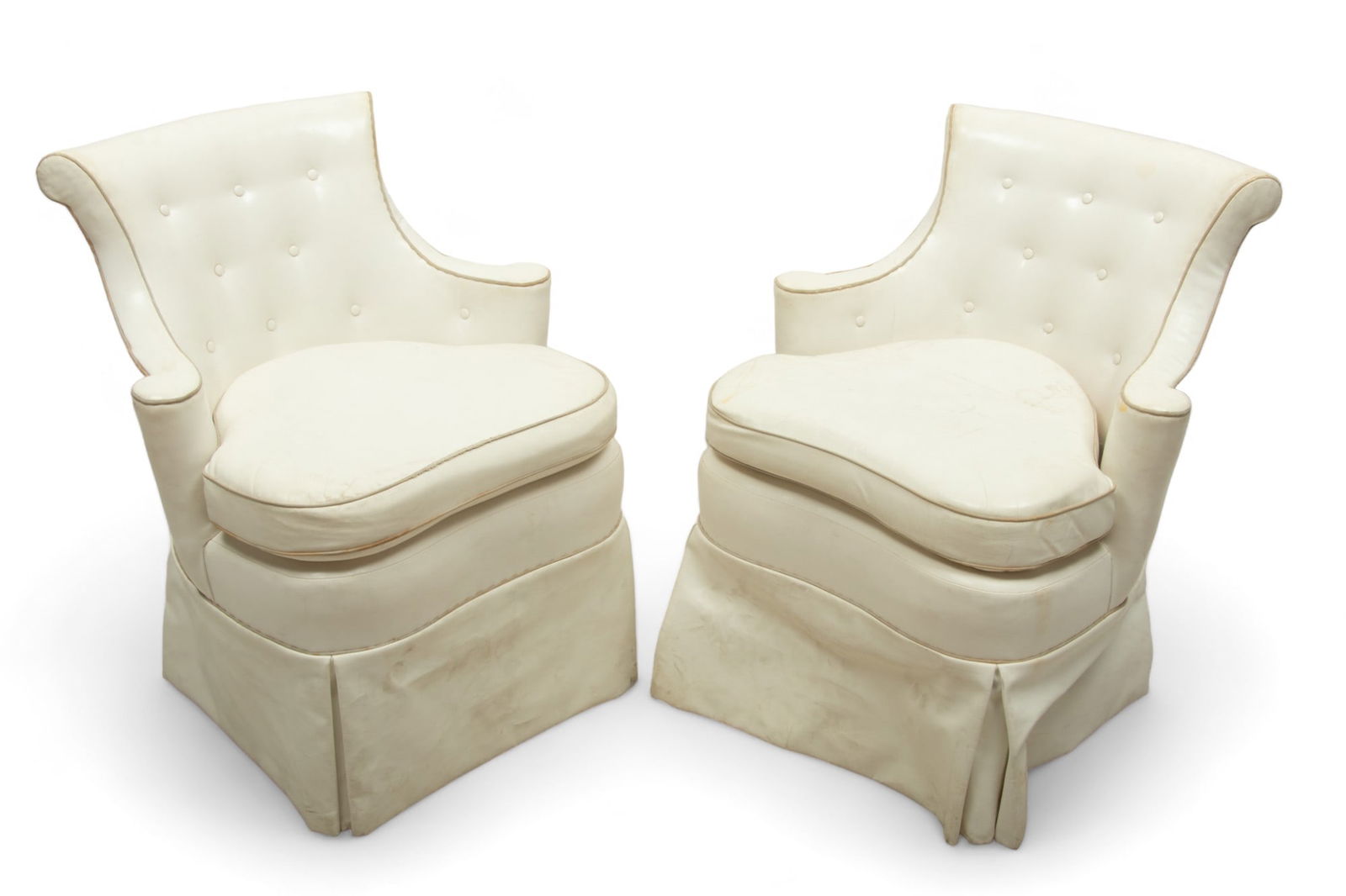 Faux Leather Upholstered Swiveling Club Chairs, Ca. 1960, H 33" W 23" Depth 20" 1 PAIR: Faux Leather Upholstered Swiveling Club Chairs, Ca. 1960, H 33" W 23" Depth 20" 1 PAIR Offering a tufted back with scrolling arms and back rest. Upholstered in white faux leather with silk piping. No