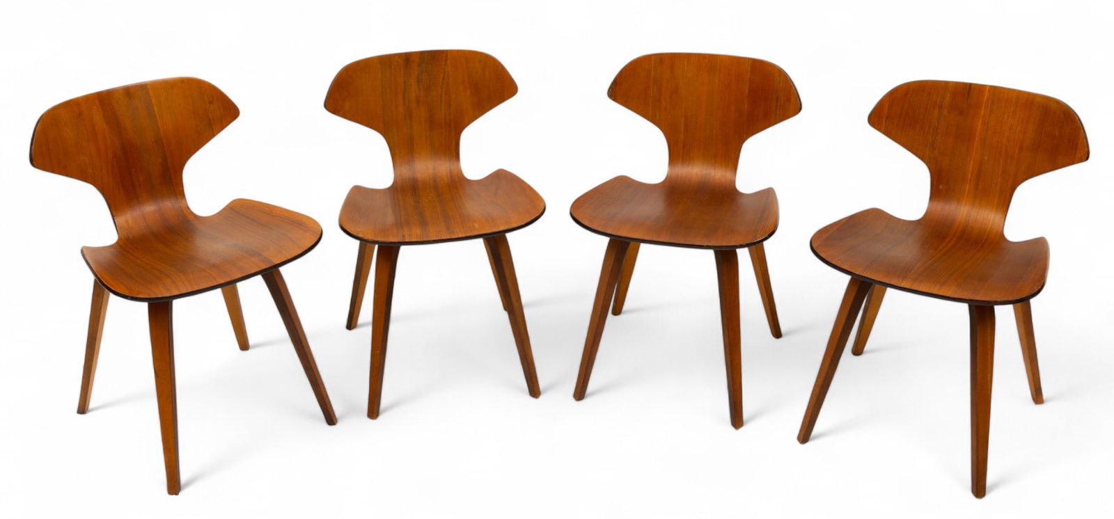 Norman Cherner for Plycraft (American, 1920-1987) Mid Century Modern Walnut Plywood Chairs H 28.75": Norman Cherner for Plycraft (American, 1920-1987) Mid Century Modern Walnut Plywood Chairs H 28.75" W 19" Depth 19" Four Norman Cherner designed sleek, walnut laminate chairs with straight, tapered le