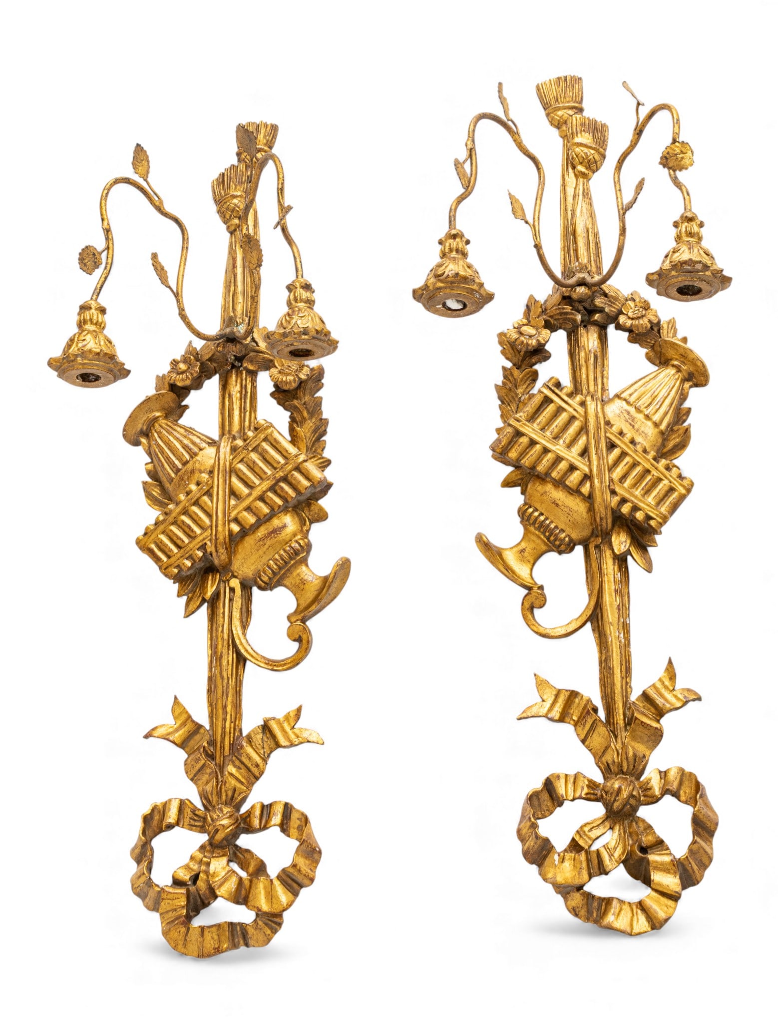 Florentine Hand Carved Gilt Wood Two Light Wall Sconces 1960, H 29" W 9" 1 PAIR: Florentine Hand Carved Gilt Wood Two Light Wall Sconces 1960, H 29" W 9" 1 PAIR Ribbon crest and tassel carved at base. Iron arms with metal leaves support two candle holders. Central wall plaque with