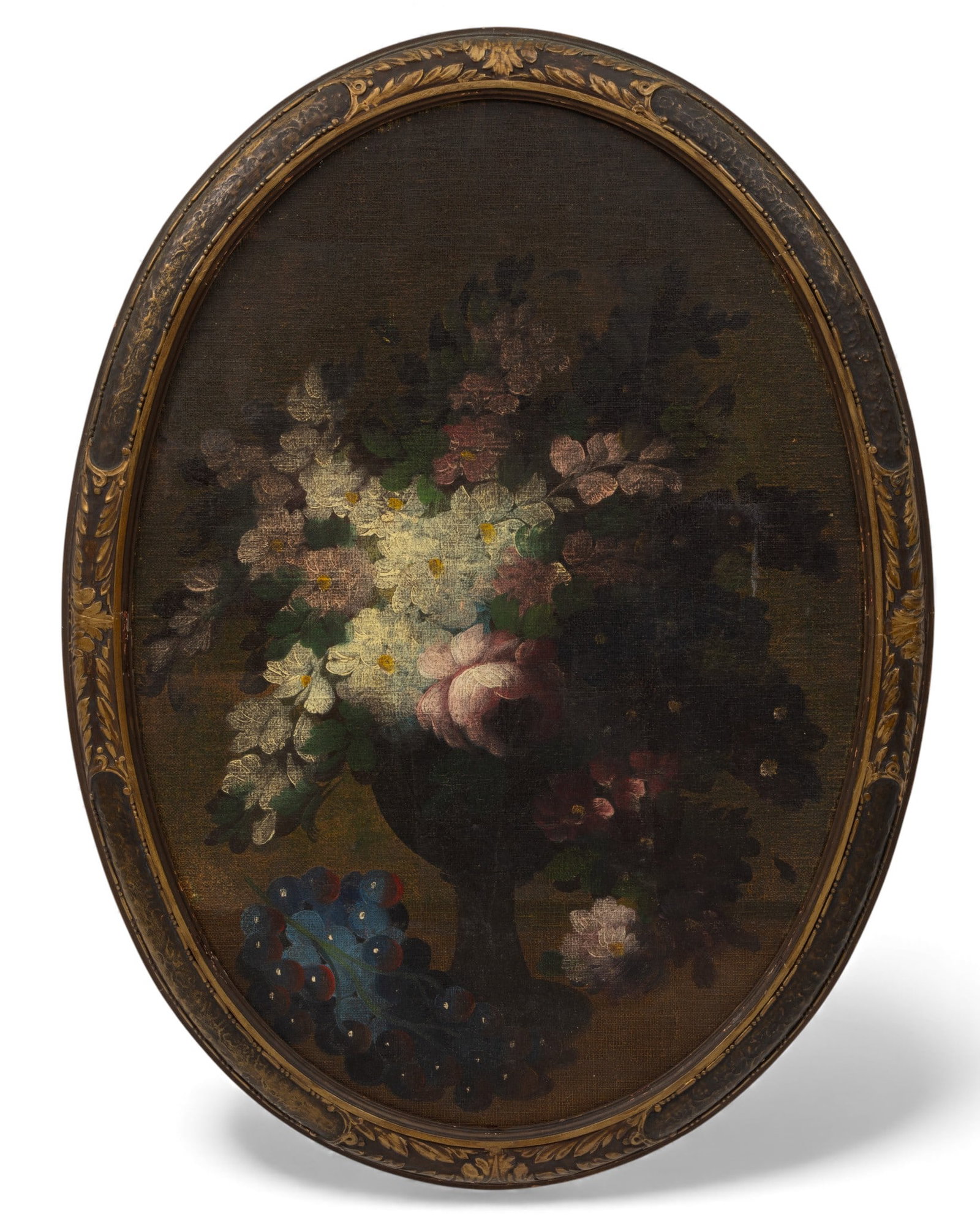 European Oil on Canvas, Ca. 19th C., 'Floral Still Life with Grapes', H 24" W 17" Frame Size: H: European Oil on Canvas, Ca. 19th C., 'Floral Still Life with Grapes', H 24" W 17" Frame Size: H 26.75" W 20" Unsigned. Oval still life painting of flowers in a pedestal vase with a cluster of grapes. 
