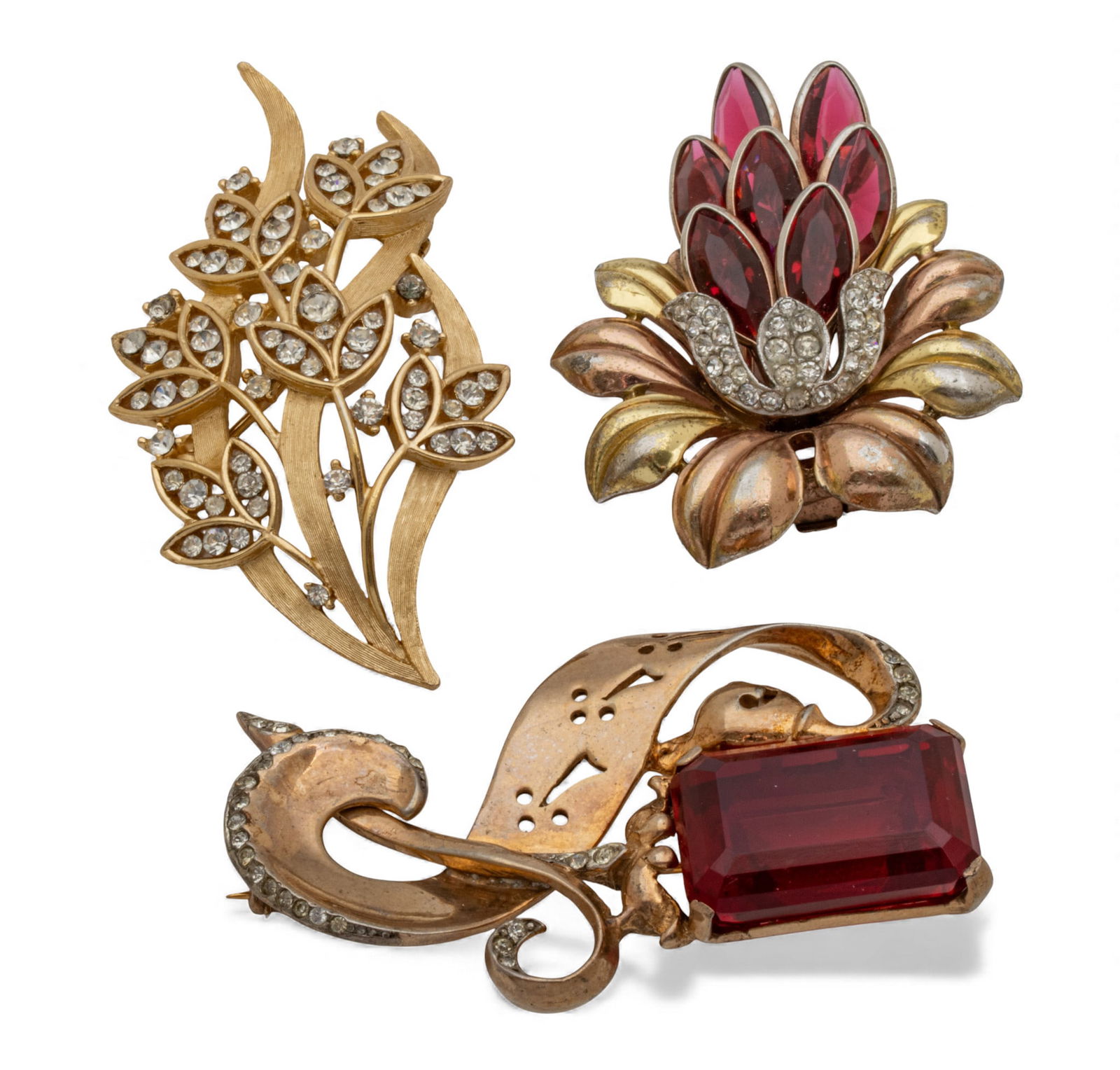 Trifari (2) Brooches + Another 3 PCS: Trifari (2) Brooches + Another 3 PCS Trifari signed brooch with 7 red stones 23.5g. Trifari signed gilt brooch with clear stones 16g. Designer brooch with large red stone 31g. Prov