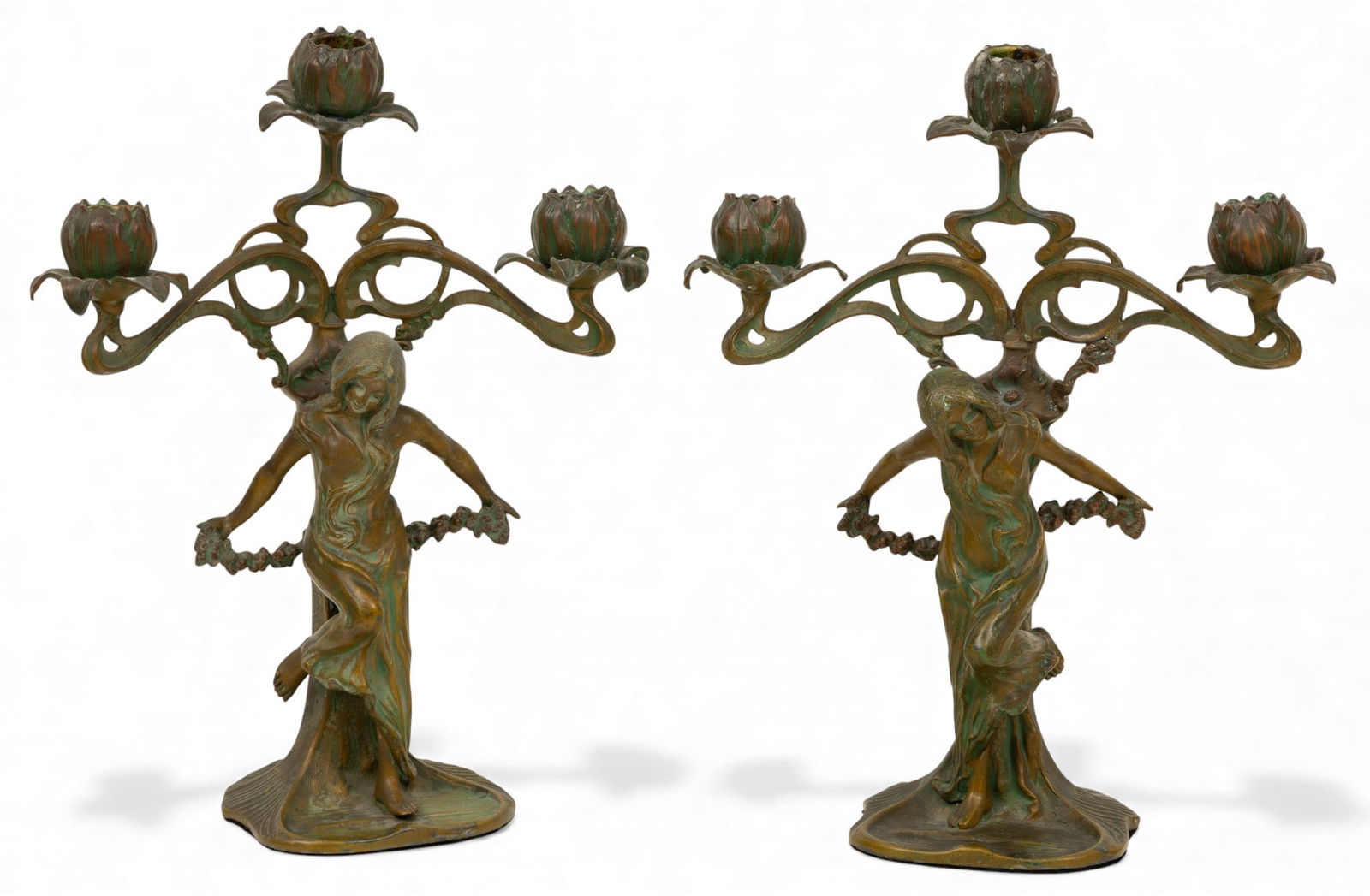 In the Manner of Auguste Moreau (French, 1834-1917) Art Nouveau Patinated Spelter Candelabrum: In the Manner of Auguste Moreau (French, 1834-1917) Art Nouveau Patinated Spelter Candelabrum 1910-1920, 'Les Nymphs Aux Lotus', H 14" W 11.5" Depth 5.5" 1 PAIR Each depicting a female figure with flo