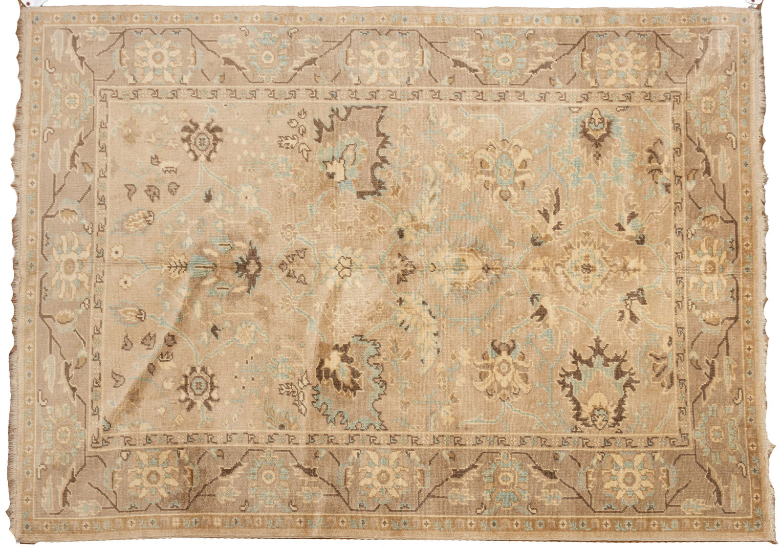 Oushak Pattern Hand Woven Wool Rug 20th Cent., W 6' 3" L 8' 6": Oushak Pattern Hand Woven Wool Rug 20th Cent., W 6' 3" L 8' 6" Taupe field with light blue, ivory and brown tones. Floral designs. Dimensions: W 6'3" L 8'6"